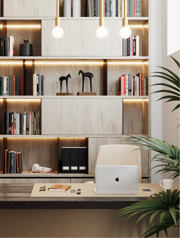 Image of desk with laptop and bookcase.