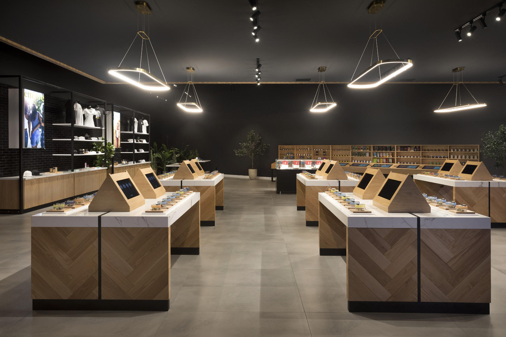 Showroom floor with display tables and overhead lighting.